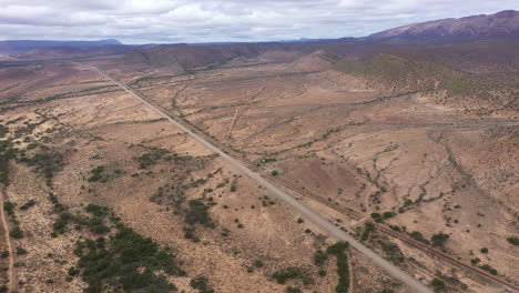 endless long road crossing arid environment in south africa countryside aerial s