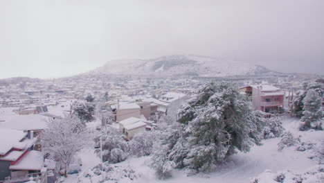 rare medea snow storm across mount lycabettus and greek residential district suburb skyline