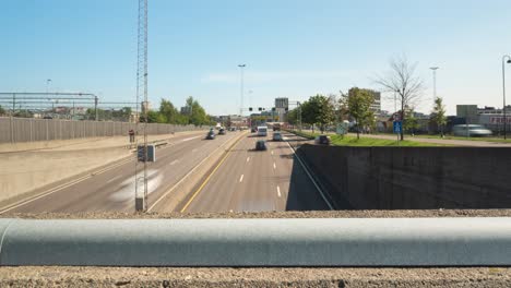 highway traffic time lapse moving under bridge intersection, slider view