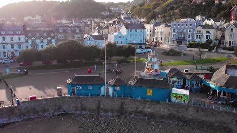 Colourful-seaside-terraces-on-the-Llandudno-waterfront,-aerial-view