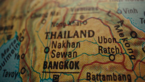 close-up of a world map highlighting thailand and bangkok