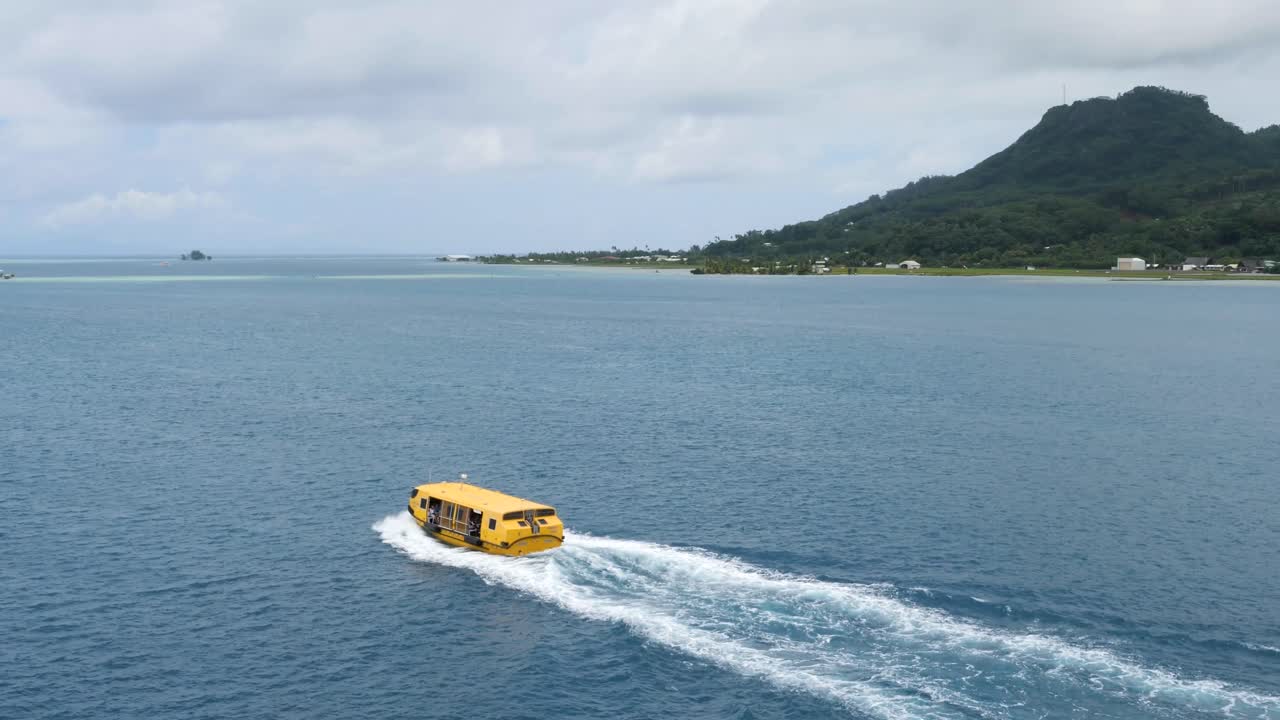 Yellow Boat Traveling on Calm Ocean Waters Near Lush Island