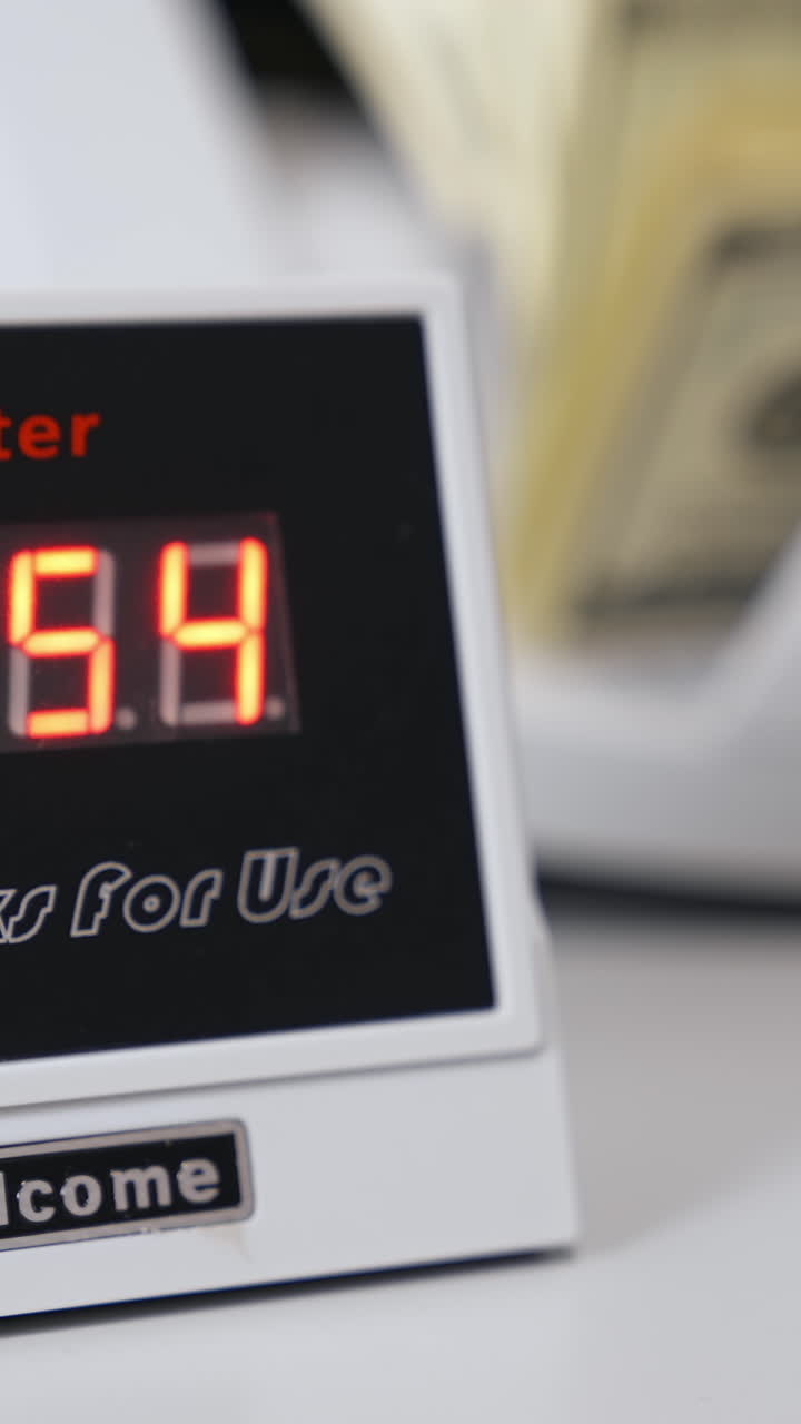 Electronic bill counter. Money counting equipment for paper money calculation. Automatic mechanism for bank financial operations. Currency exchange. Vertical video