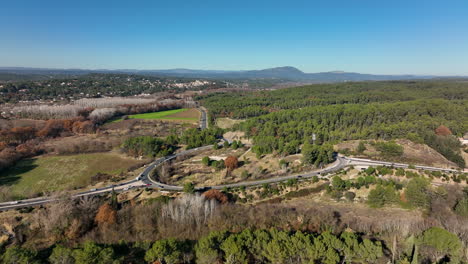 Roundabout-aerial-shot-in-Montpellier-north-district-green-vegetation-backdrop