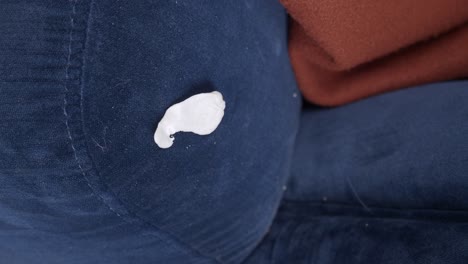 chewing gum stuck on blue fabric