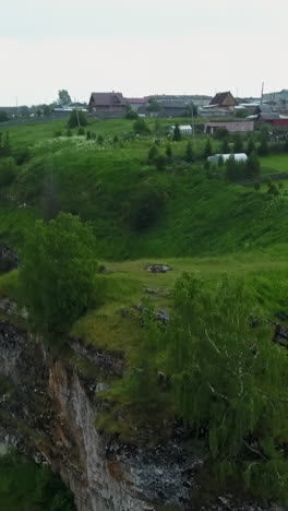 rural landscape with village and cliffs