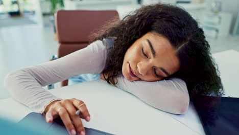 tired woman in office