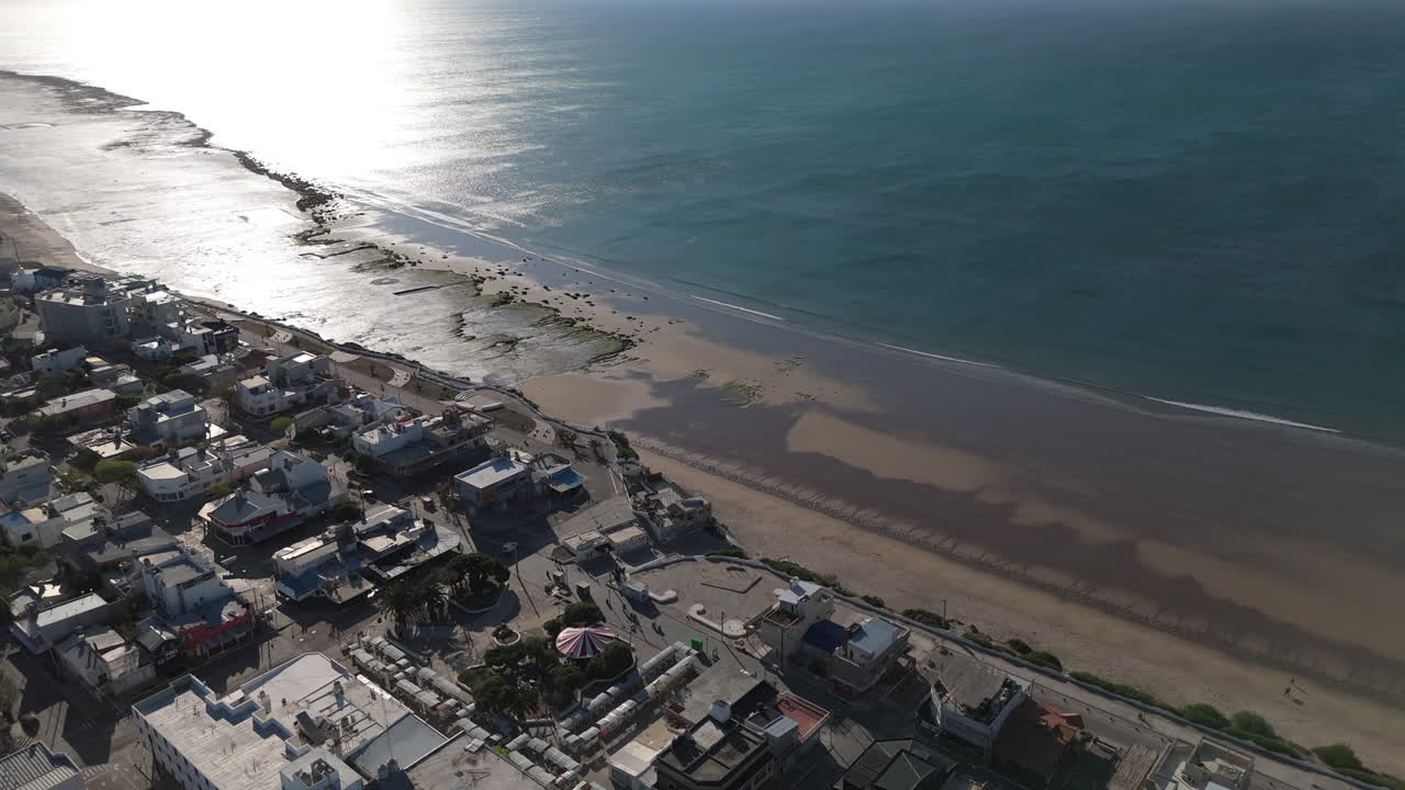Enjoy a stunning bird's eye view of Las Grutas, Argentina, showcasing its beautiful beaches and rugged coastline.