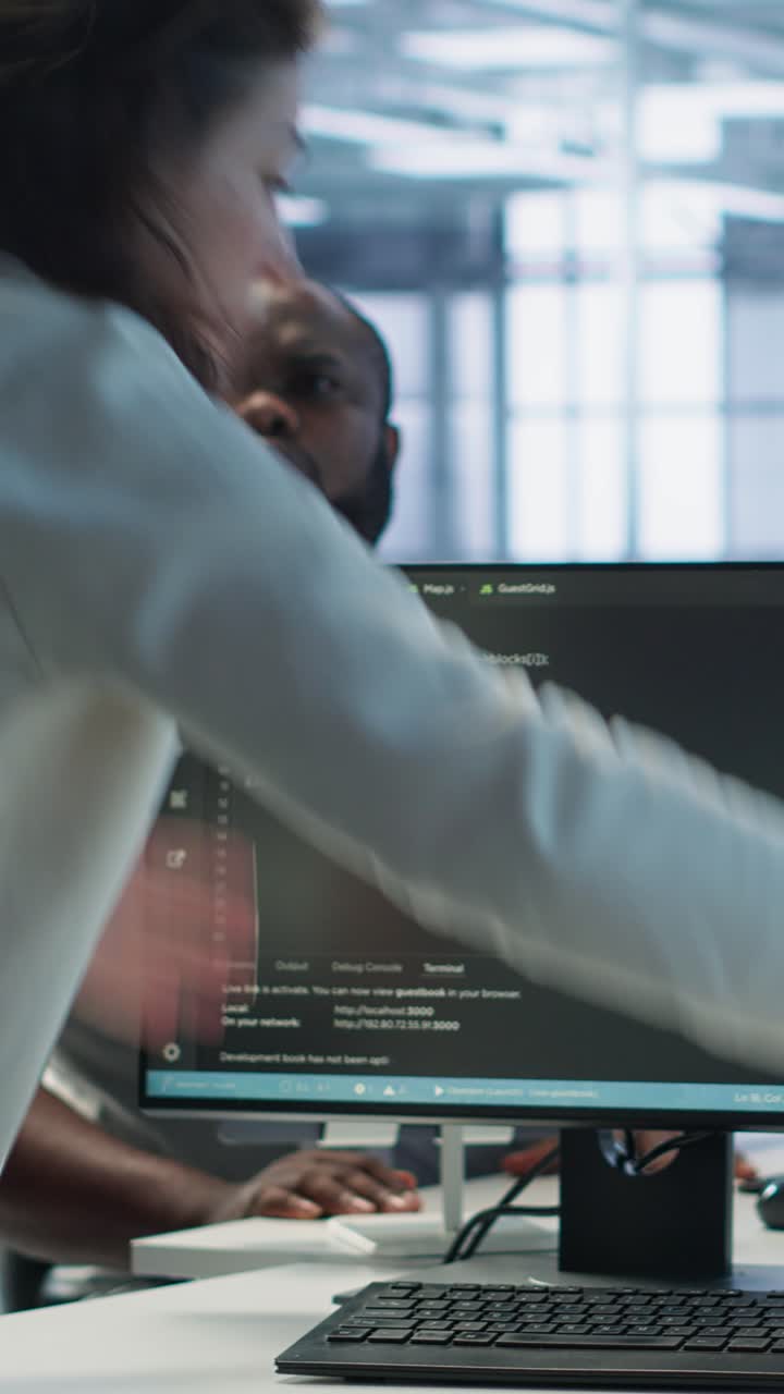 Programmers Collaborating on Software Code in Modern Office