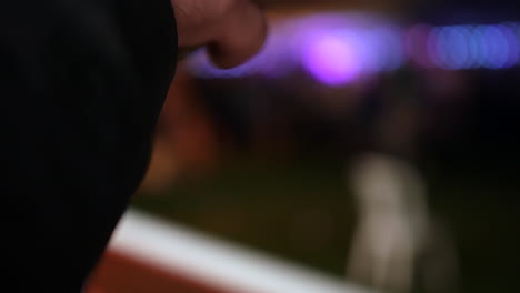 Unrecognizable-man-drinking-beer-at-a-music-festival-concert