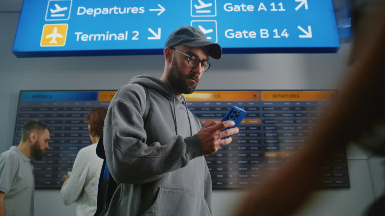 People at Airport Checking Flight Information