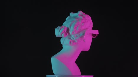 ancient bust with 3d glasses in neon light