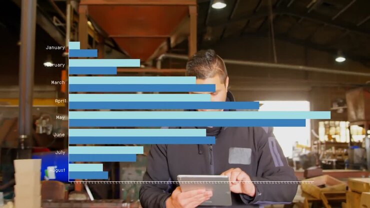 Animation of graph over biracial man in workshop