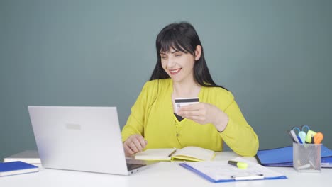 woman shopping from laptop.