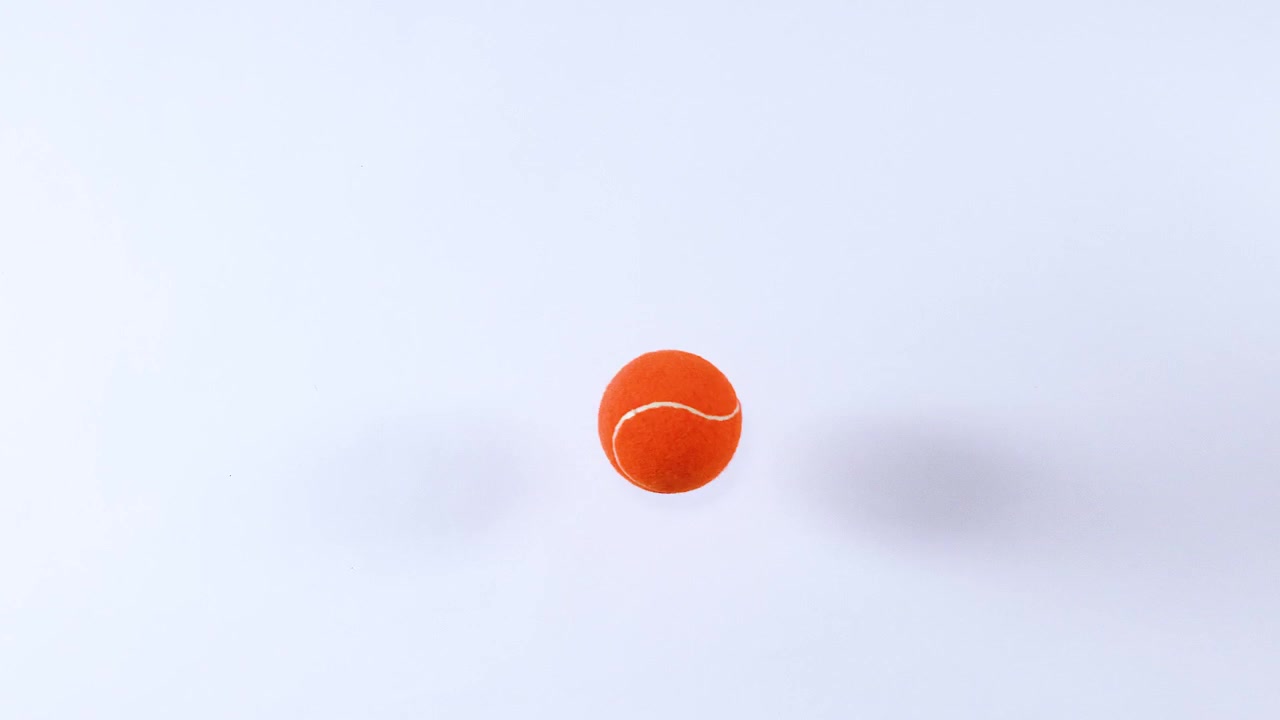 Tennis ball bouncing on a flat surface
