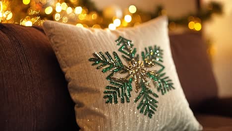 christmas snowflake pillow on a couch