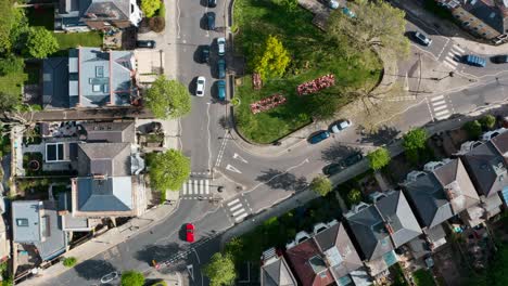 top down drone shot of small triangular roundabout uk