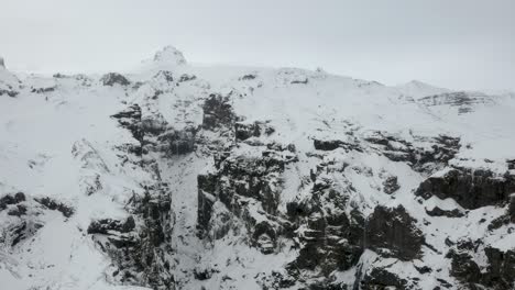 aerial drone footage approaching canyon mulagljufur in south iceland. wintery arctic landscape.