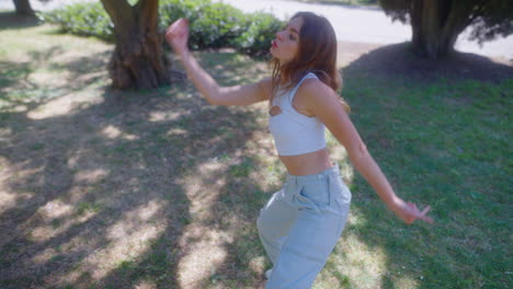 woman dancing in a park