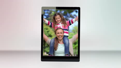 video of a family in a park on tablet computer