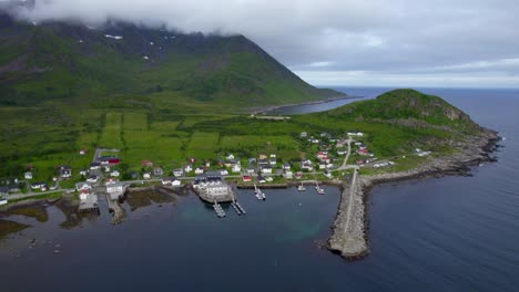 aerial sideway pan of mefjordvar during summer on senja island