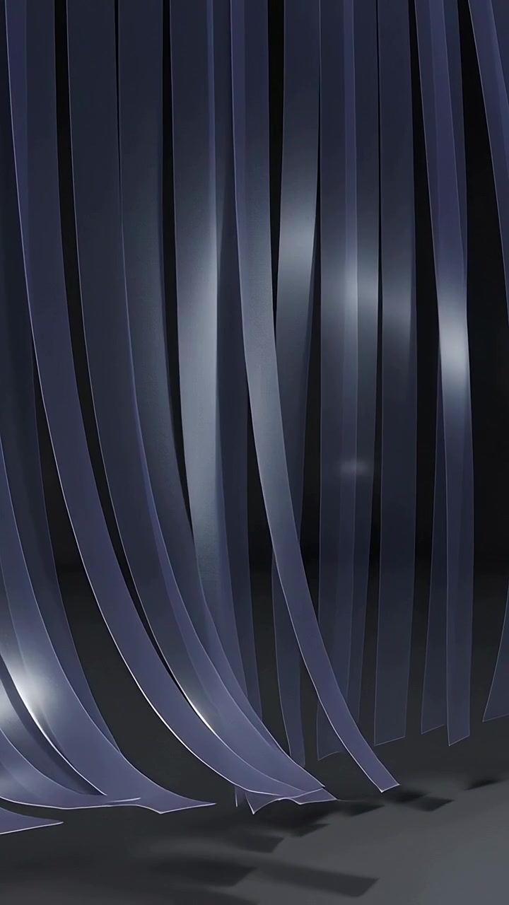 Vertical video: Entering from upper-right dark ribbons aligning vertically in dark studio, on floor