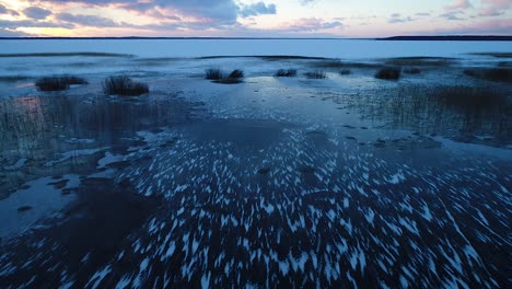 Super-cold-frozen-lake-in-evening-sunset-blue-light