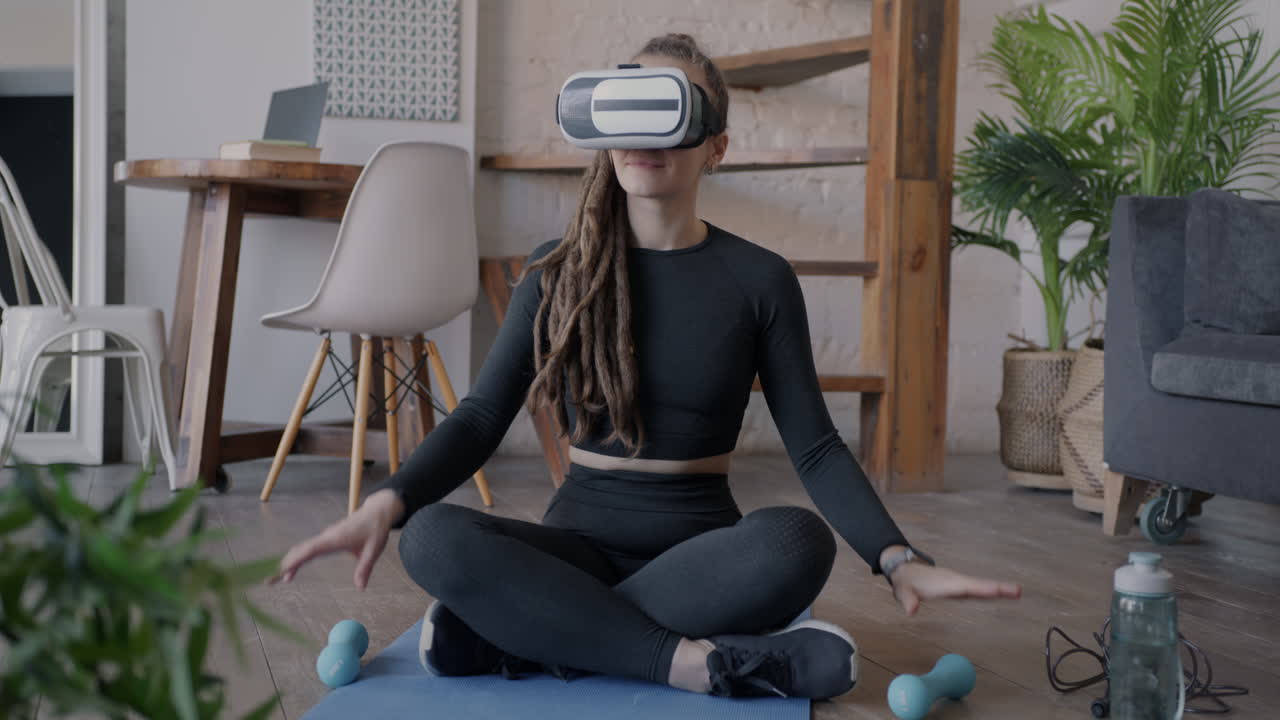 Woman exercising with VR headset at home