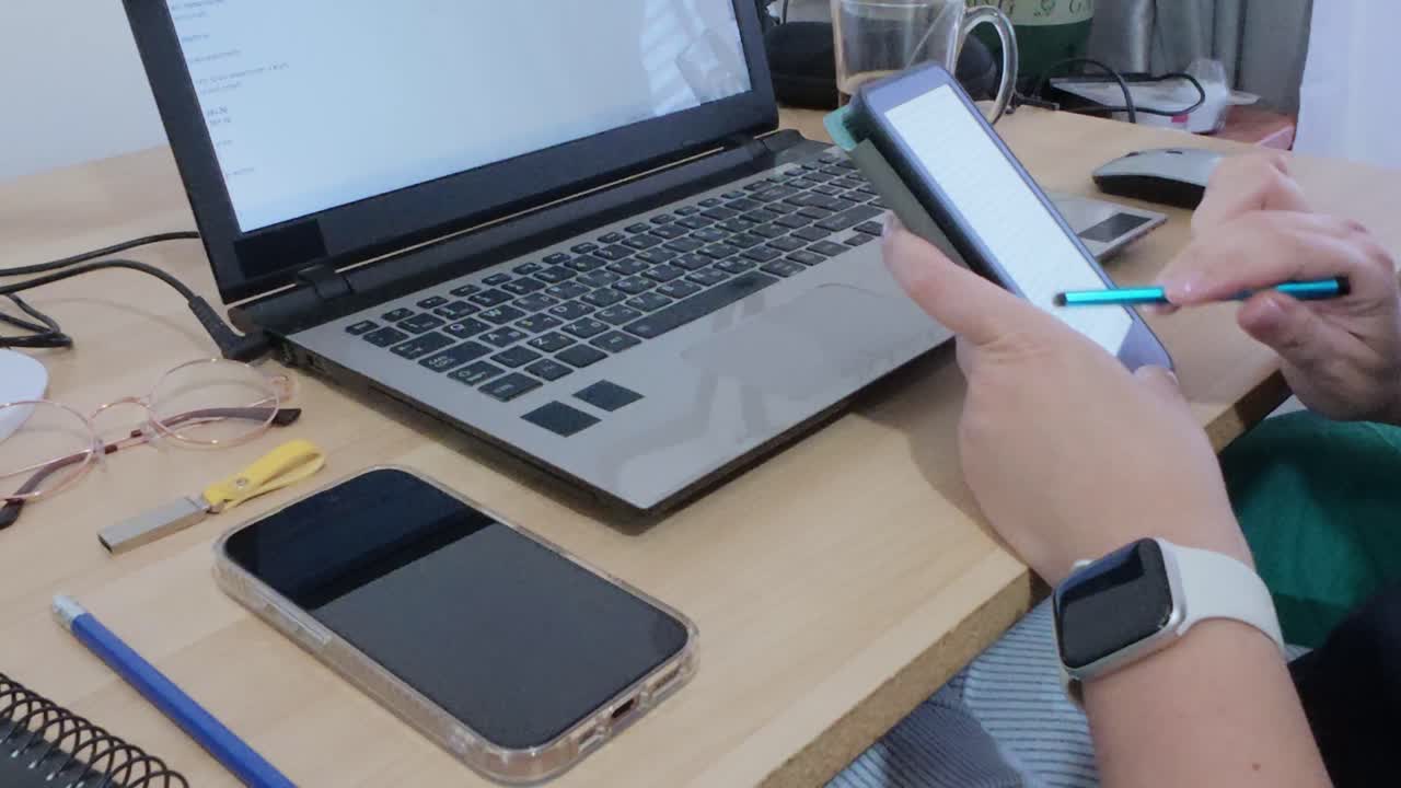 Hands of a creative professional using a tablet with a stylus for design or illustration