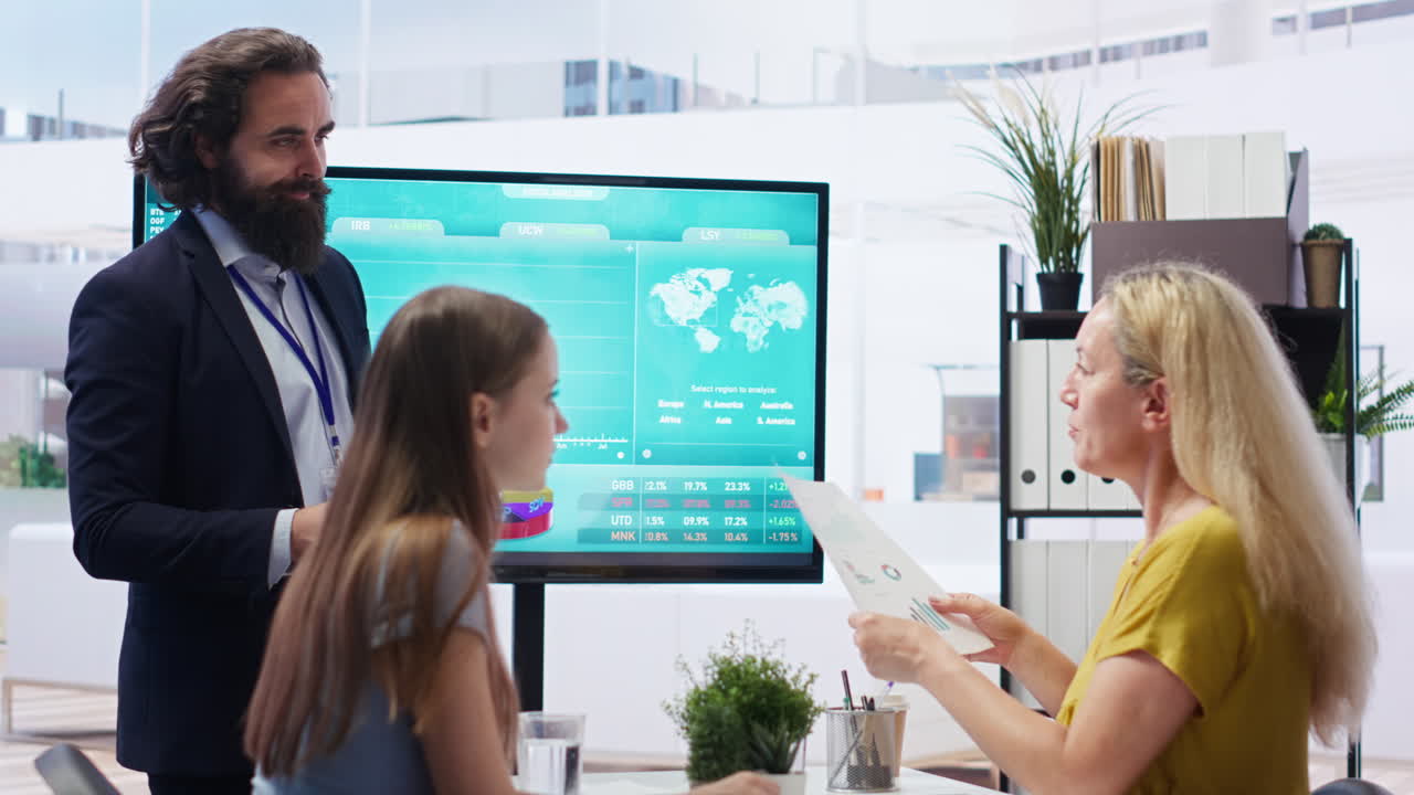 Agent teaching parent and daughter how to invest, offering statistical graphs