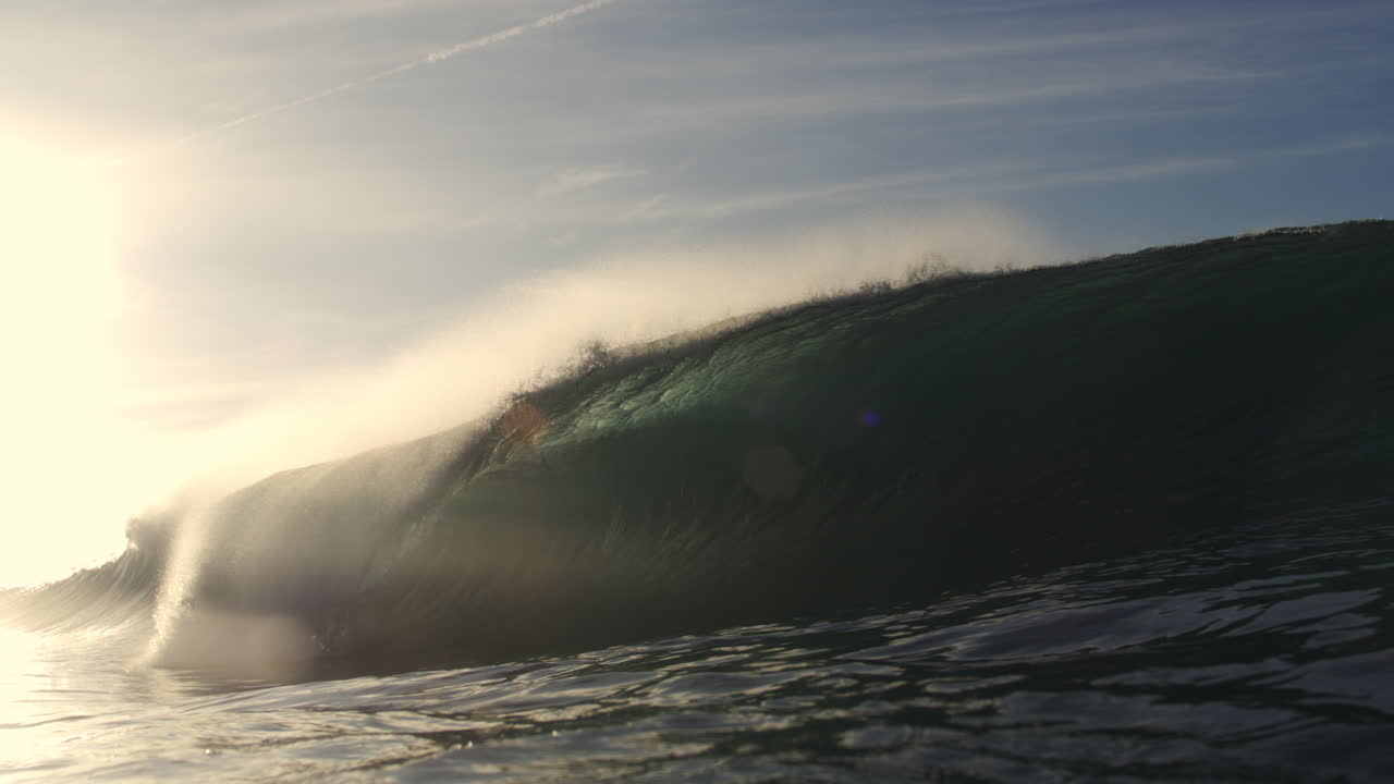 Powerful Ocean Wave Breaking with Golden Backlight at Sunset