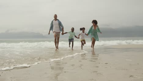 family enjoying free time by the sea