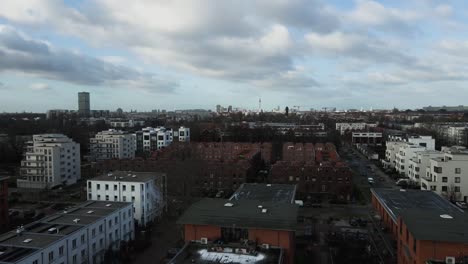 Berlin-City-drone-shot-with-cloudy-sky-and-post-car-coming-by