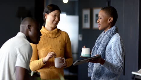 casual diverse business people talking together in office, slow motion, copy space