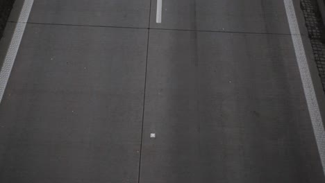 huge trailer trucks and car moving fast on the asphalt road in zlotoryja, poland - top-down shot