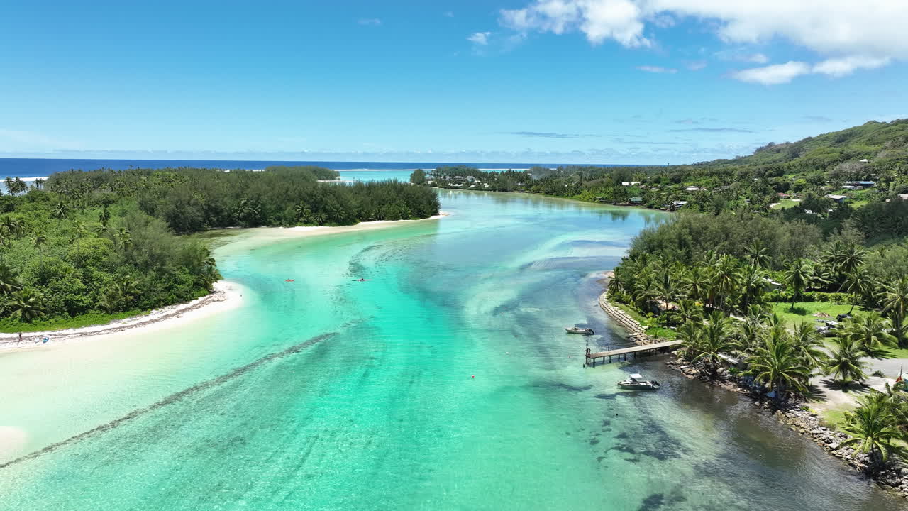 Muri Lagoons panoramic overview with stunning green lush waters and sandy bottoms, aerial, Cook Islands Rarotonga