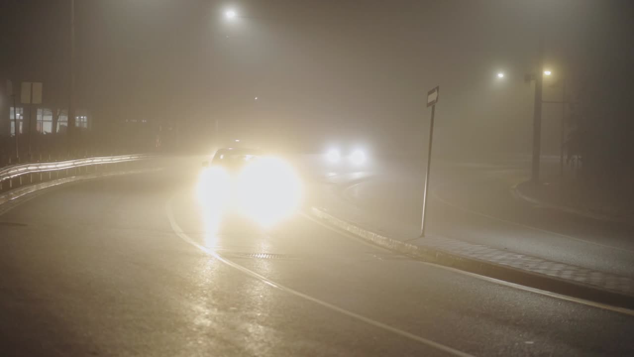 Cars On The Foggy Road During Night Hours - wide