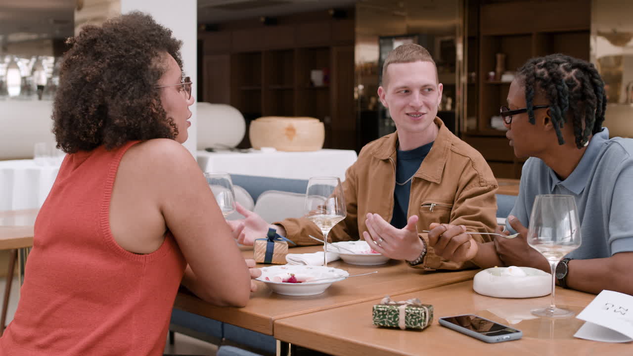 Friends enjoying a meal in a modern restaurant