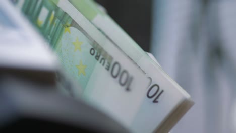 machine counter automatic calculates a large amount of euro banknotes in 4k slow motion 60fps
