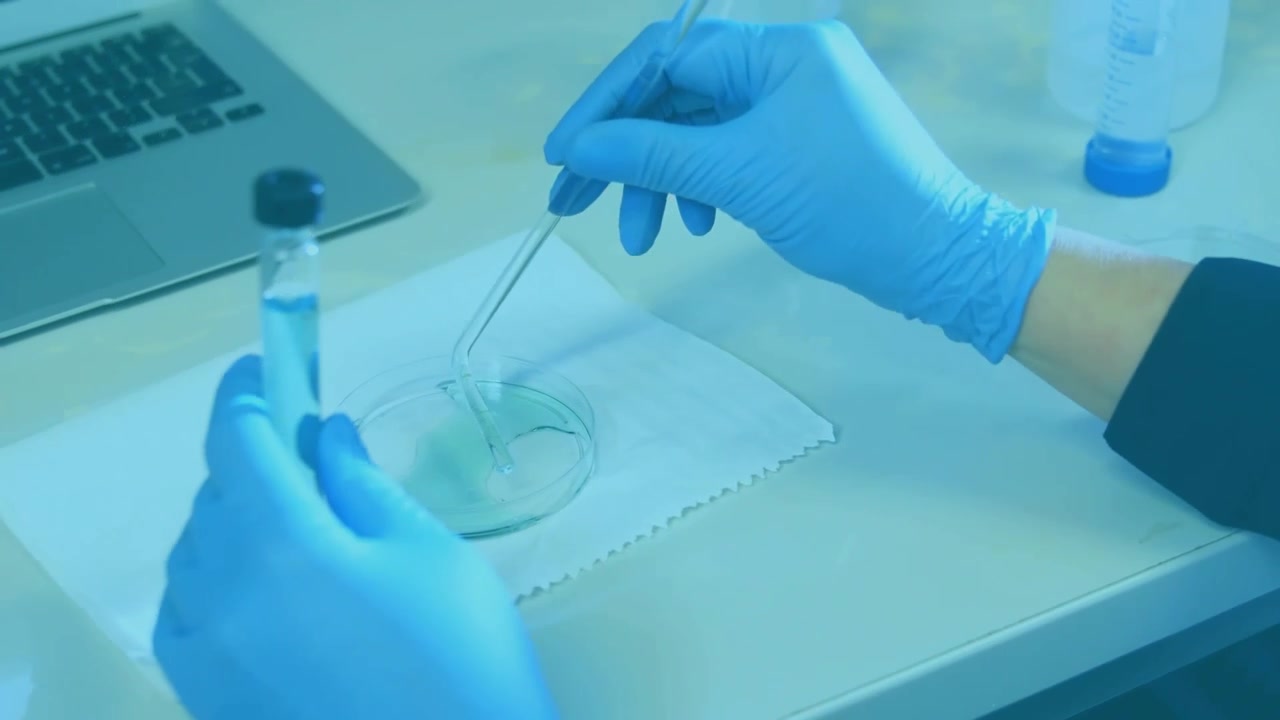 Lab tech prepping liquid sample lowering pipette to dish while dot overlay tracking motion for test