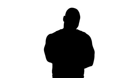 muscular silhouette of man with arms crossed