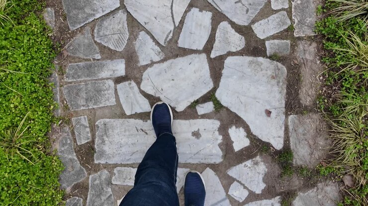 Walking on a Stone Path in a Garden