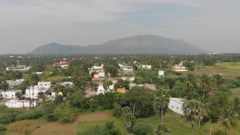 Huge-mountains-in-the-background-of-the-frame-covered-with-lush-greens