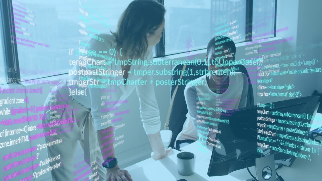 Developer reviewing code after mentor leaning and pointing at monitor in tech office