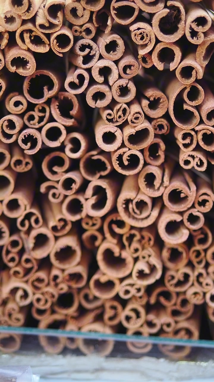 Close-up of Stacked Cinnamon Sticks in a Market