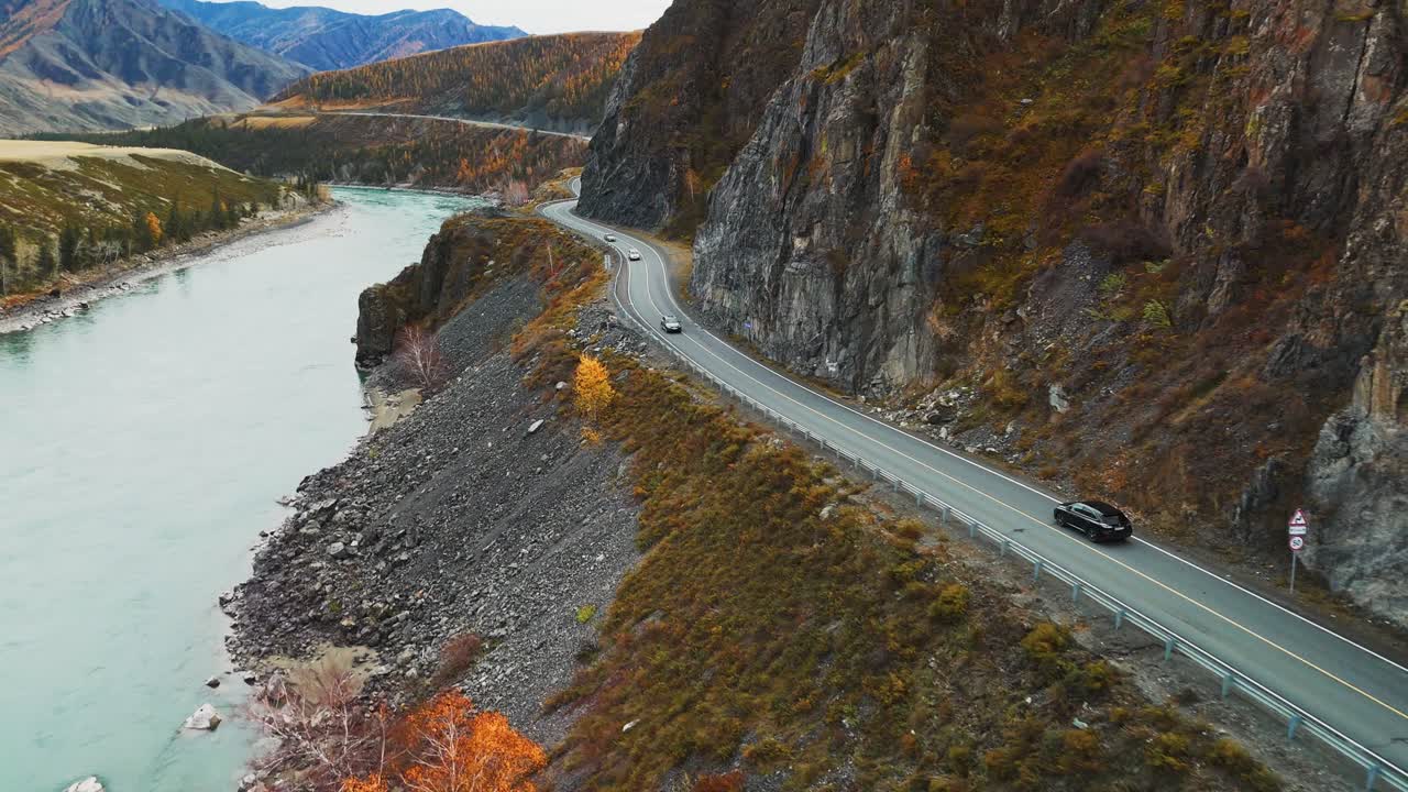 Scenic Mountain Road Trip Along a River in Autumn