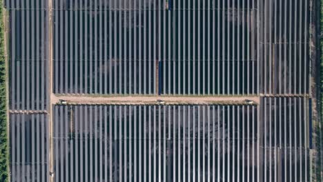 parque solar fotovoltaico cumayasa - bird's eye view of solar farm and rows of solar panels in dominican republic - drone shot