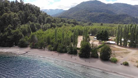 aerial tilt to beach at lago espejo campground in patagonia, argentina