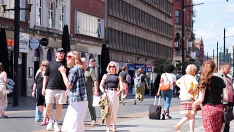 people walking and interacting in cardiff city center