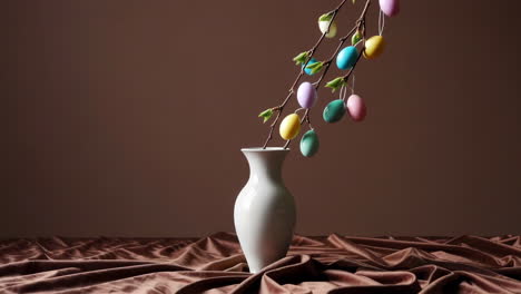 colorful easter eggs decoration in a white vase